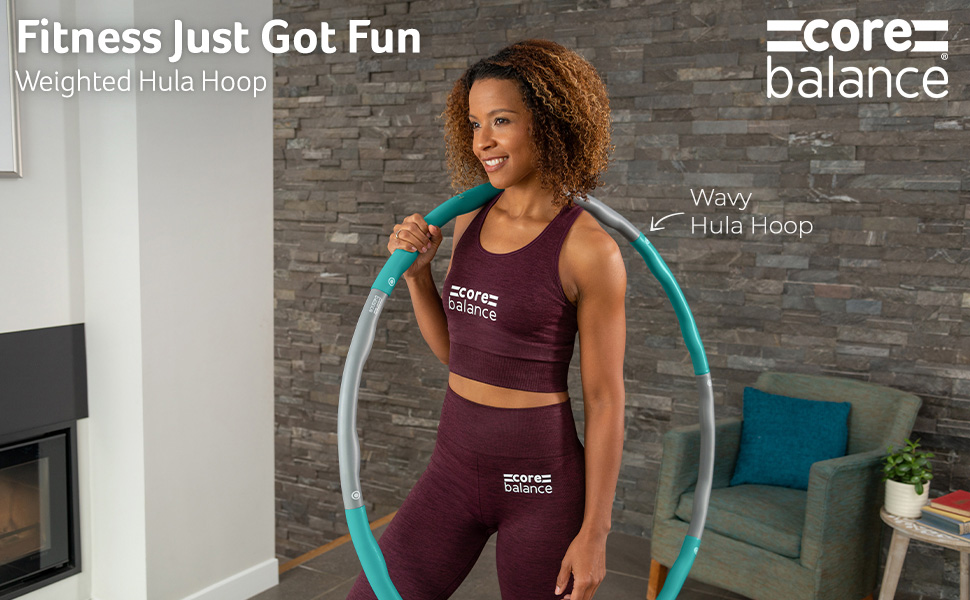 Lady holding a Core Balance Weighted Hula Hoop